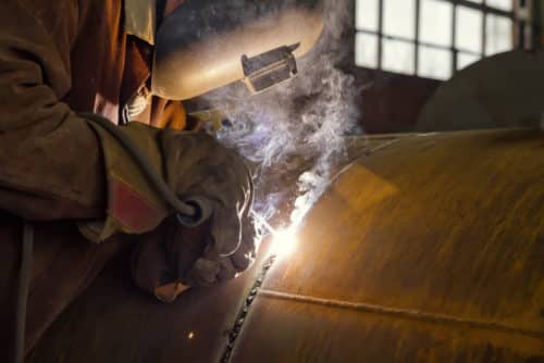 welder performs welding large diameter pipe